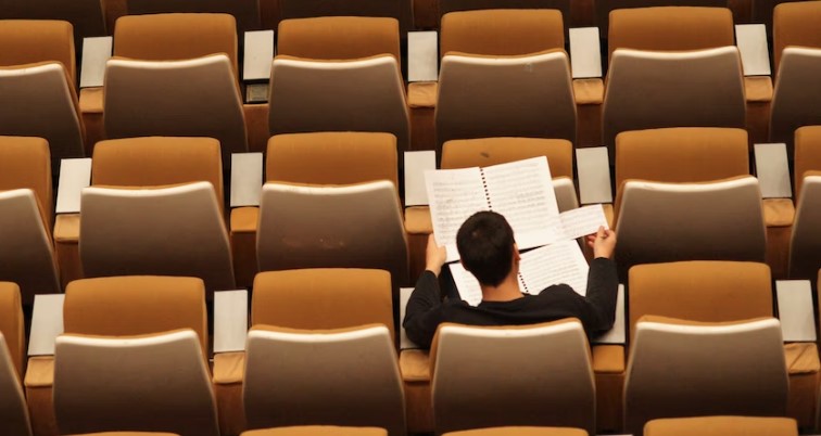 College Student in a seat on his own - Isolated managing stress